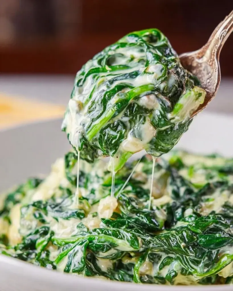 Delicious creamed spinach garnished and ready to serve