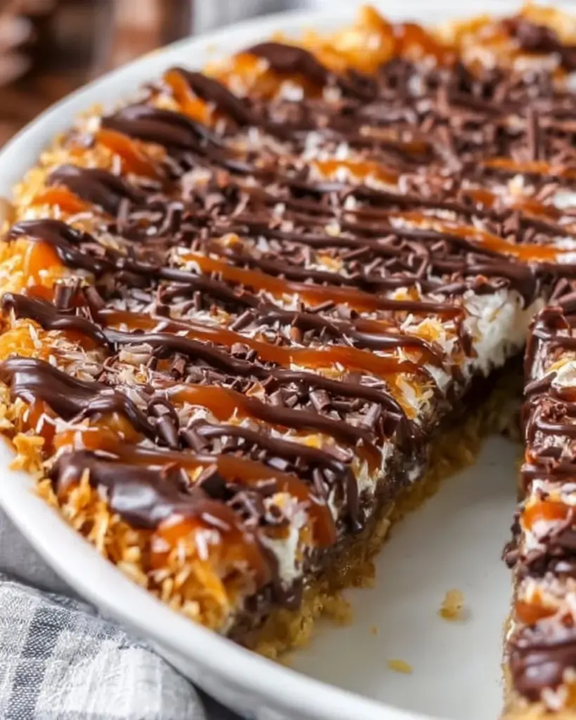 Delicious Samoa Cookie Pie with chocolate, coconut, and caramel layers