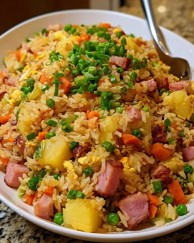 Delicious Pineapple Fried Rice with Ham served in a vibrant bowl