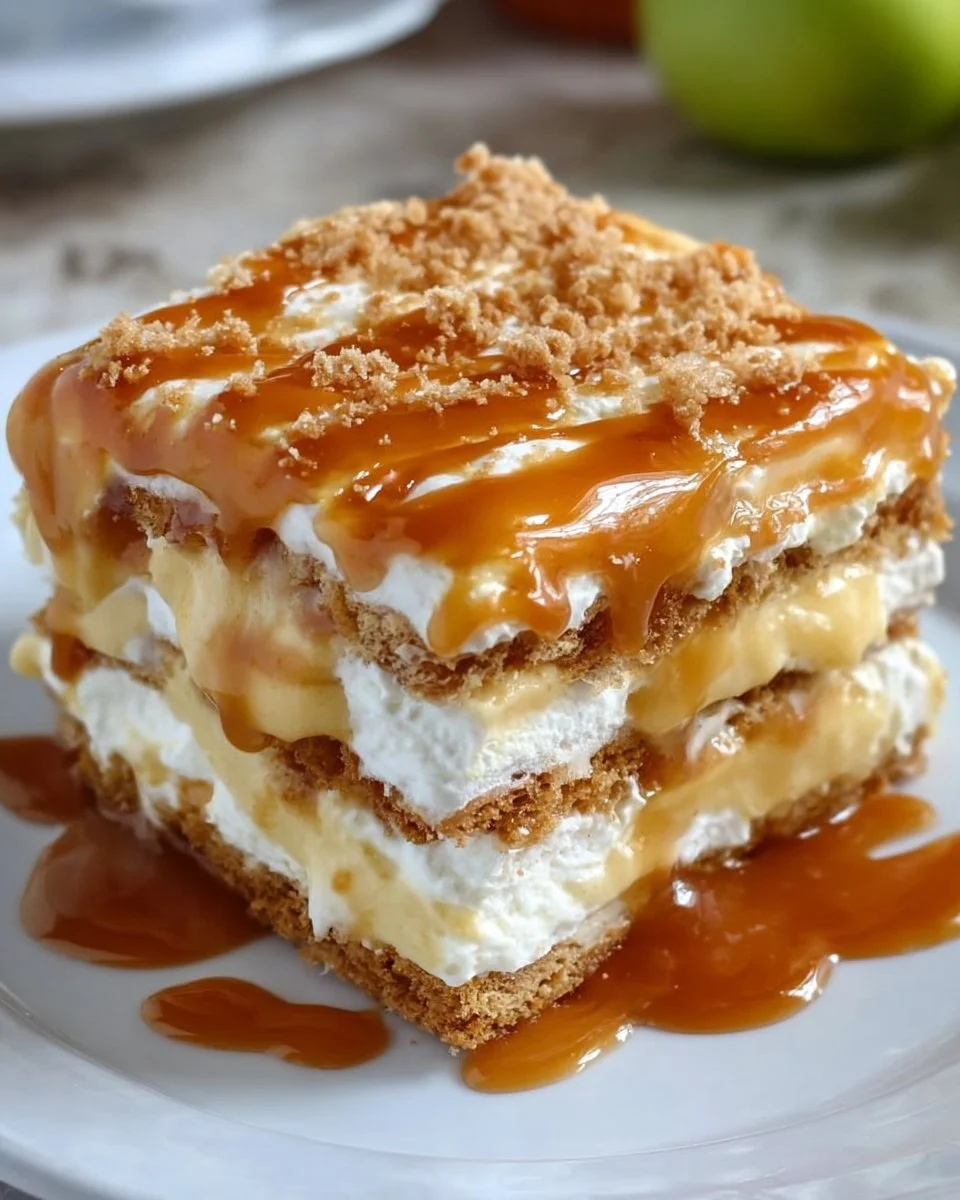 Delicious Caramel Apple Eclair Cake with caramel drizzle and apple slices.
